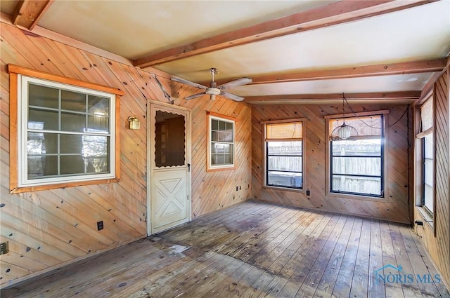 interior space featuring wood-type flooring, lofted ceiling with beams, and ceiling fan