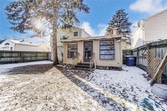 view of snow covered house