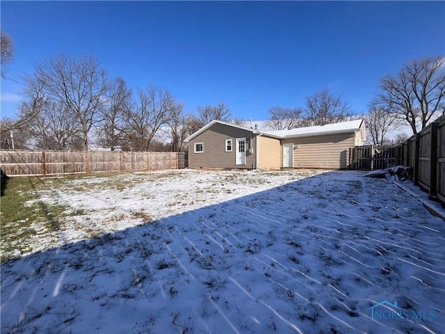 view of snow covered house