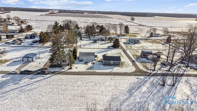 snowy aerial view featuring a rural view