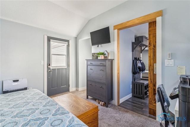 carpeted bedroom with vaulted ceiling