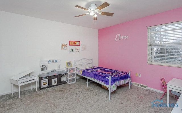 bedroom featuring ceiling fan and light carpet