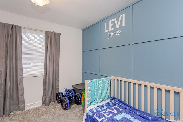 unfurnished bedroom featuring ceiling fan and carpet floors