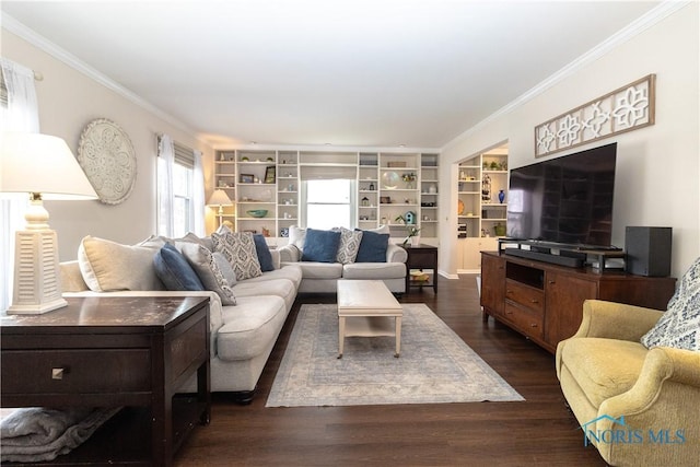 living room with built in shelves, dark hardwood / wood-style floors, and crown molding