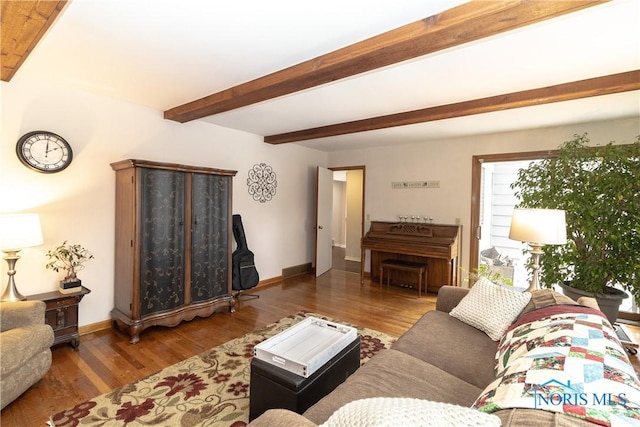 living room with wood-type flooring and beamed ceiling