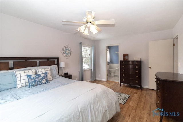 bedroom featuring ceiling fan, connected bathroom, and light hardwood / wood-style floors