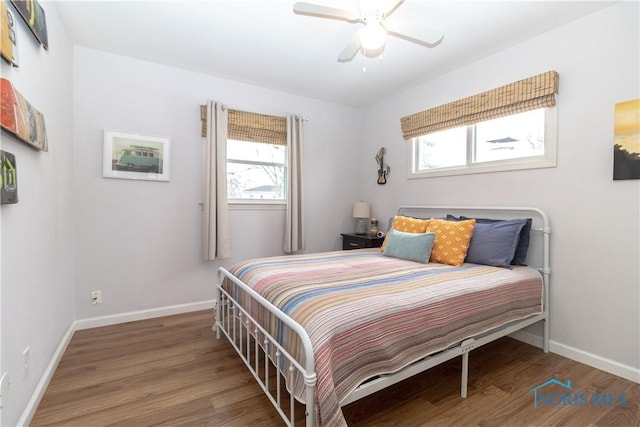 bedroom with ceiling fan and hardwood / wood-style floors