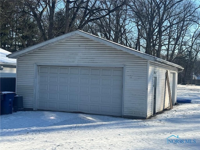 view of snow covered garage