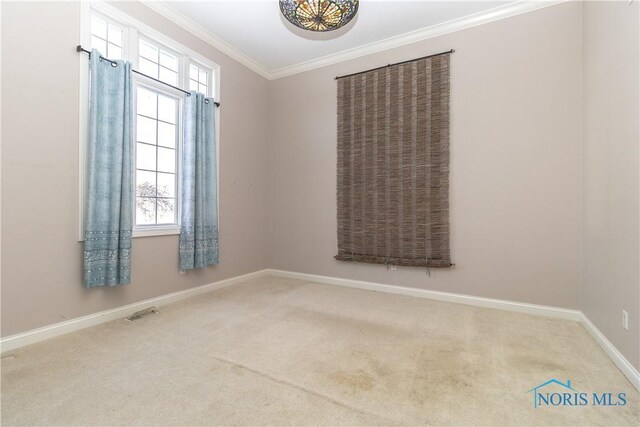 empty room with carpet floors and ornamental molding