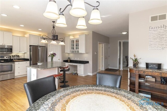 dining room featuring light hardwood / wood-style flooring