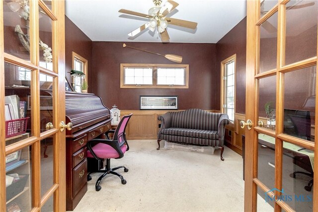 home office with ceiling fan, light colored carpet, and french doors