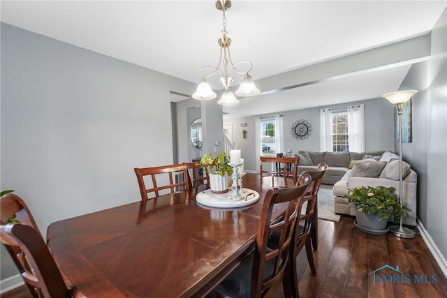 dining space with dark hardwood / wood-style floors