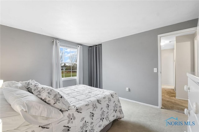 bedroom featuring light colored carpet