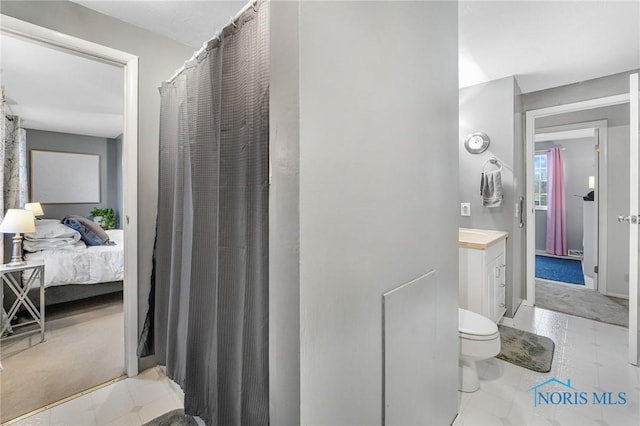 bathroom with vanity and toilet