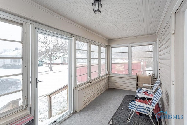 sunroom featuring wooden ceiling