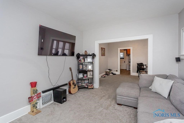 living room featuring light colored carpet