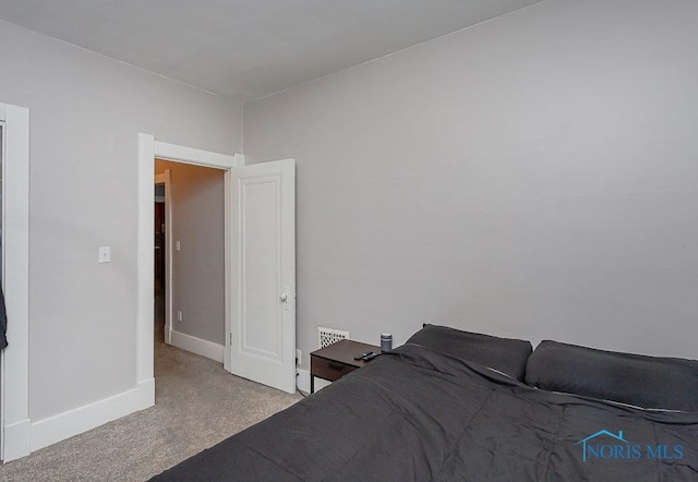 unfurnished bedroom with light colored carpet