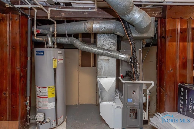 utility room featuring gas water heater