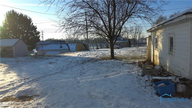 view of yard covered in snow