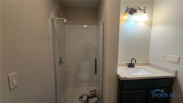 bathroom featuring vanity and a shower with door