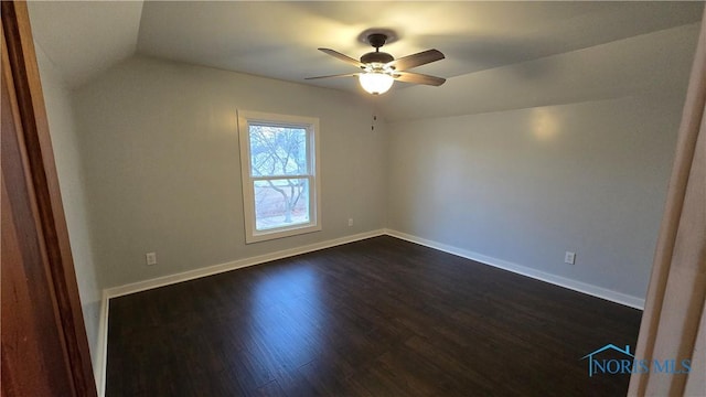 unfurnished room featuring dark wood-type flooring, ceiling fan, and lofted ceiling