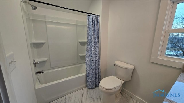 bathroom featuring toilet and shower / bath combo with shower curtain