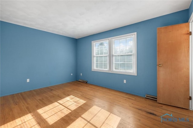 spare room featuring light wood-type flooring