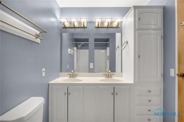 bathroom with vanity and toilet