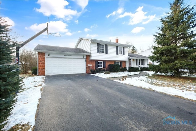 split level home featuring a garage