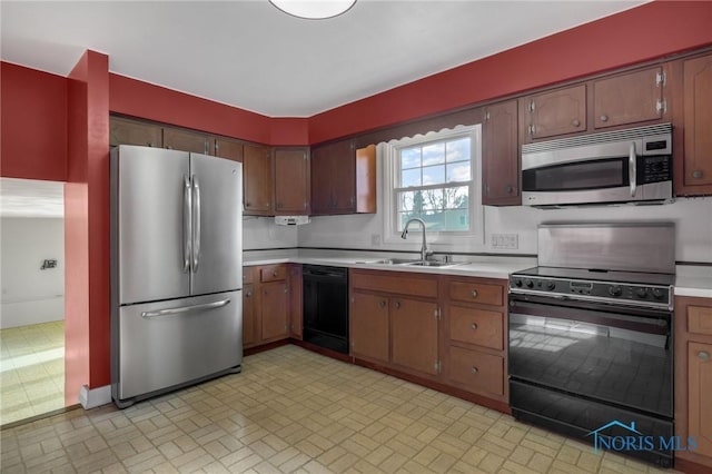 kitchen featuring sink and black appliances