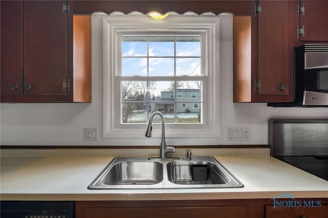 kitchen with dishwasher and sink