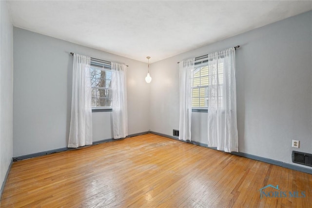 empty room featuring hardwood / wood-style floors