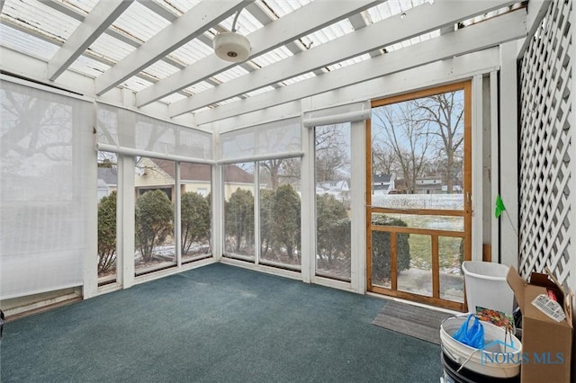 unfurnished sunroom with beamed ceiling