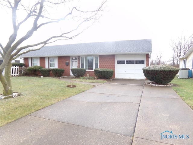 single story home featuring a garage, central AC unit, and a front lawn