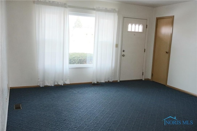 entrance foyer with carpet floors