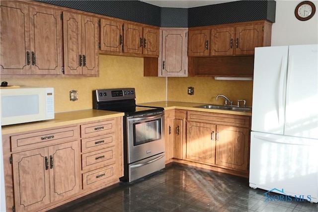 kitchen with white appliances and sink