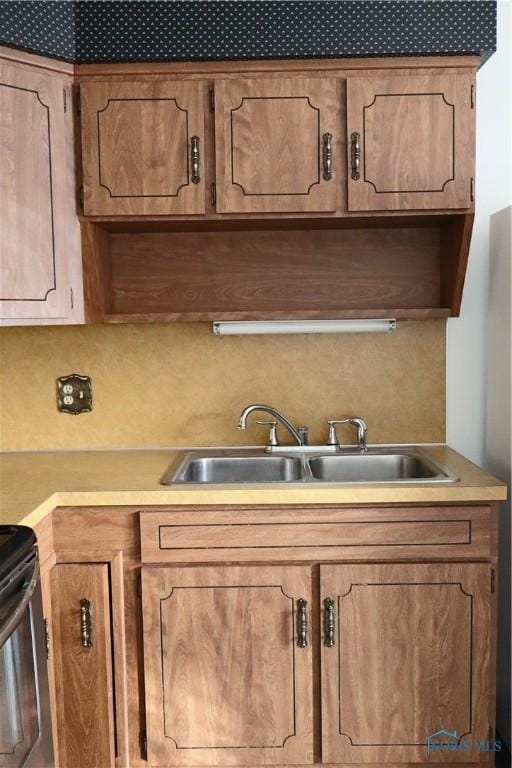 kitchen featuring sink and stainless steel electric range