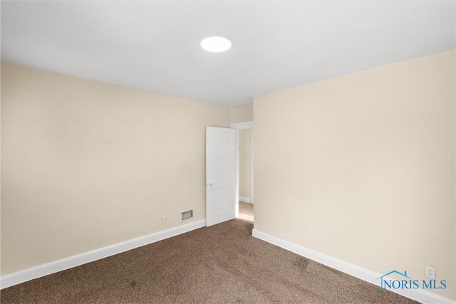 empty room with carpet flooring