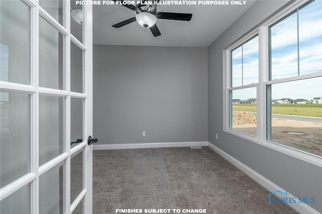 carpeted spare room with ceiling fan and french doors