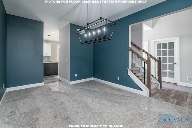 unfurnished dining area featuring a chandelier