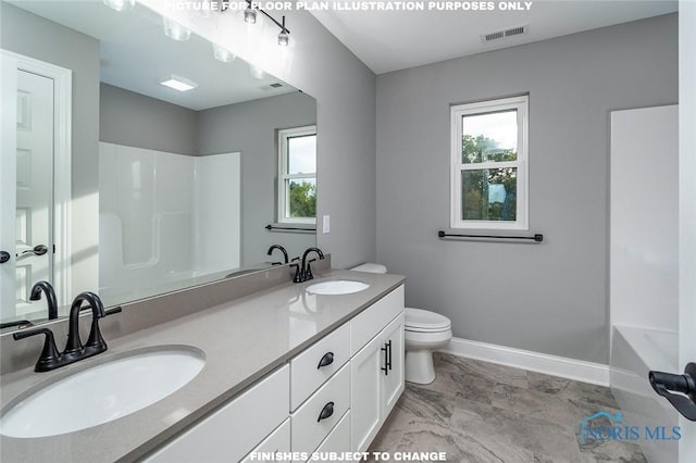 bathroom featuring toilet and vanity