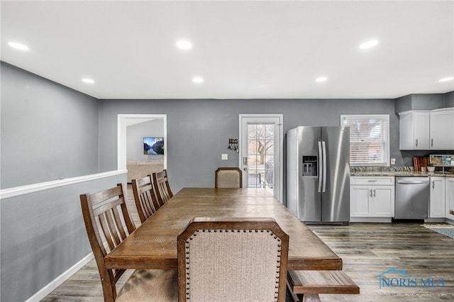 dining room featuring dark hardwood / wood-style flooring