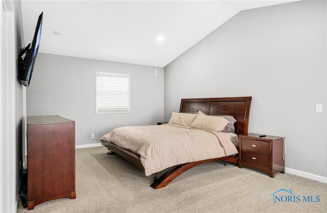 bedroom with light carpet and vaulted ceiling