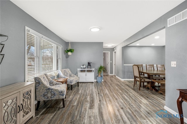 sitting room with hardwood / wood-style floors