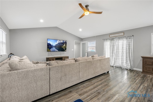 living room featuring ceiling fan, lofted ceiling, a wealth of natural light, and hardwood / wood-style flooring