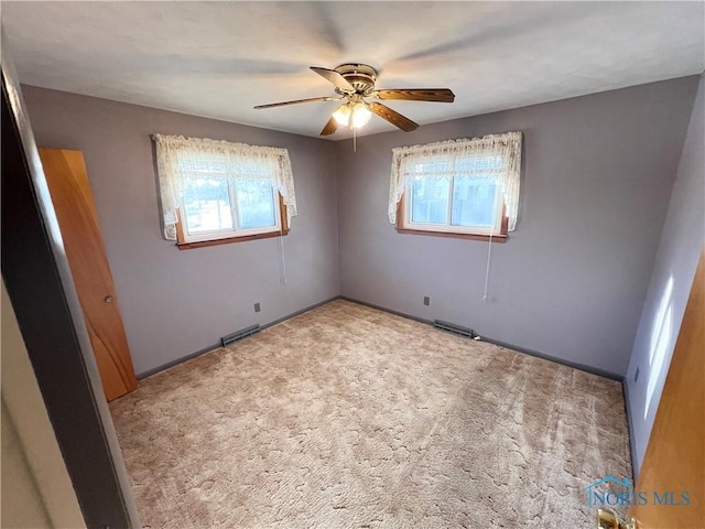 unfurnished bedroom with ceiling fan and carpet floors