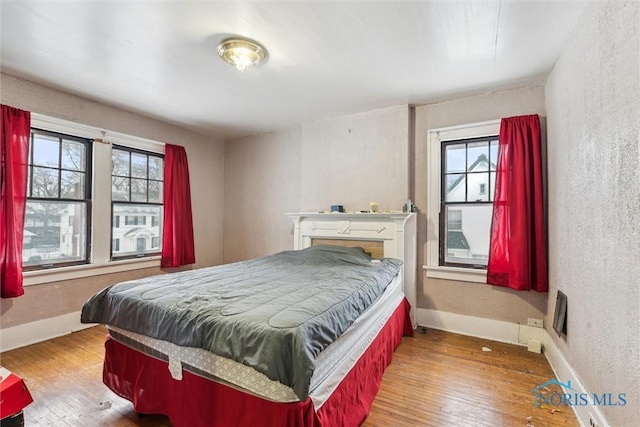 bedroom featuring hardwood / wood-style flooring