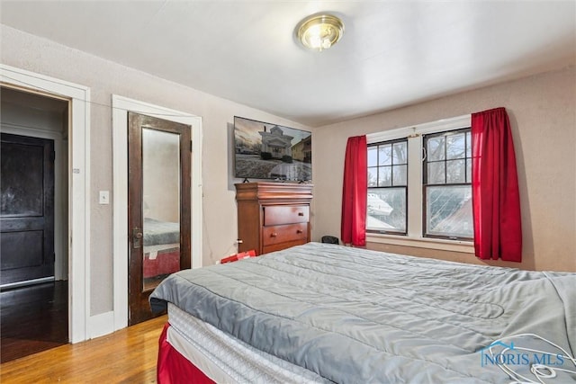 bedroom featuring hardwood / wood-style floors