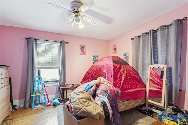 bedroom featuring light wood-type flooring and ceiling fan