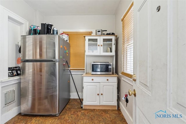 kitchen with white cabinets and stainless steel appliances